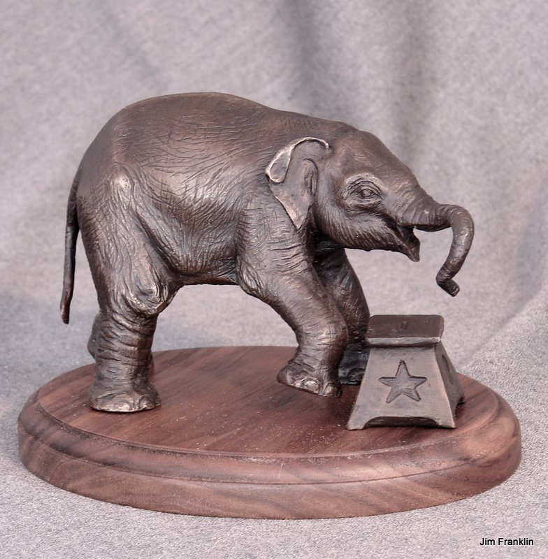 Baby Elephant with sttol mounted on wooden base